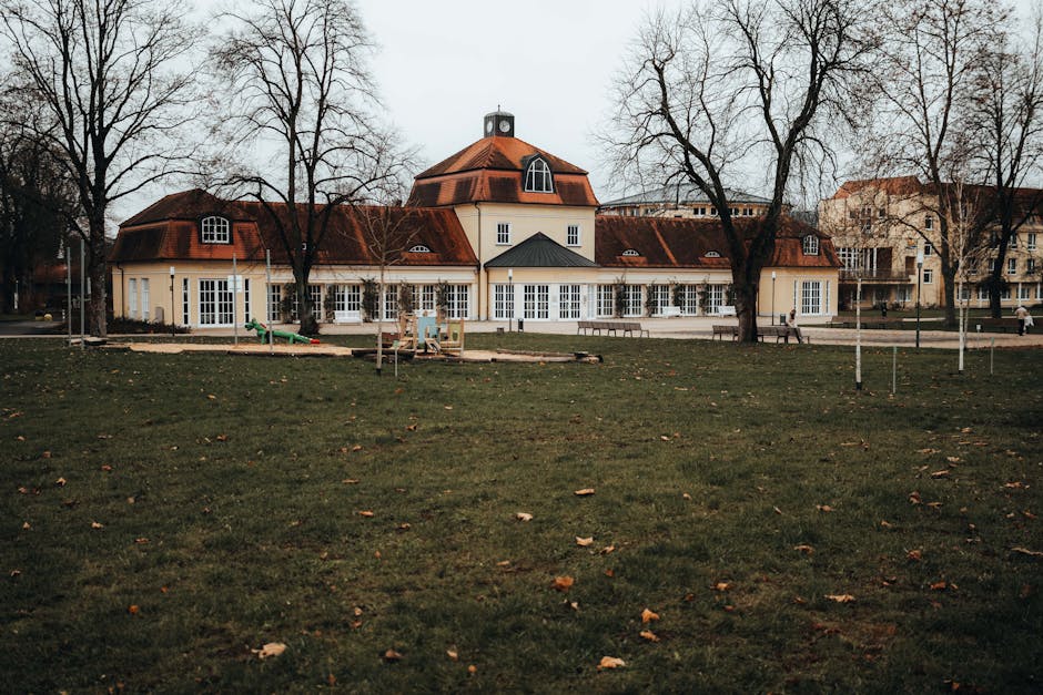 A historic building with unique architecture in Bad Hersfeld park, surrounded by bare trees in winter.