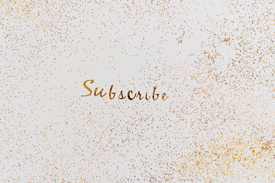 Golden 'Subscribe' text with charming glitter effect on a clean background.